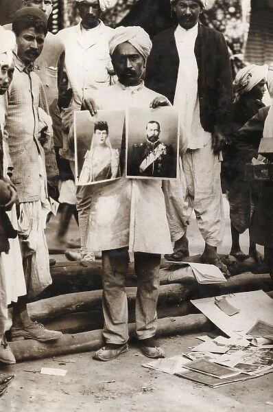 Indian street vendor with pictures of George V and Mary