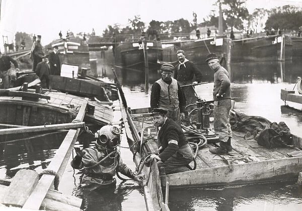 WWI: divers clearing sunken pontoon bridge, River Oise
