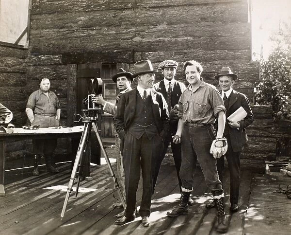 SILENT FILM SET, c1925. Actor Harold Lockwood (holding baseball) and director Fred Balshofer on the set of a silent film, c1925