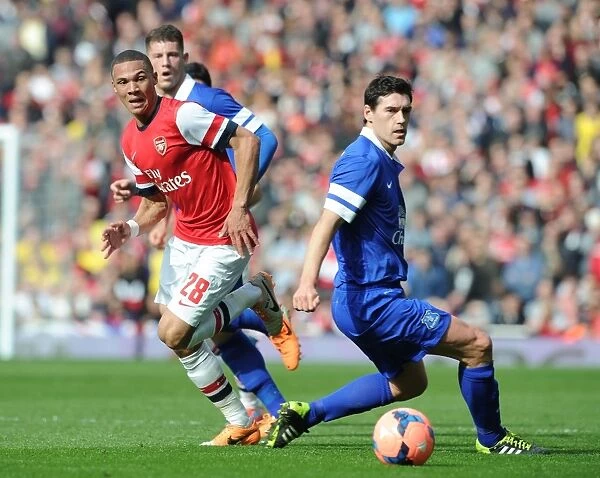 Arsenal's Kieran Gibbs Outmaneuvers Everton's Gareth Barry in FA Cup Quarter-Final Showdown