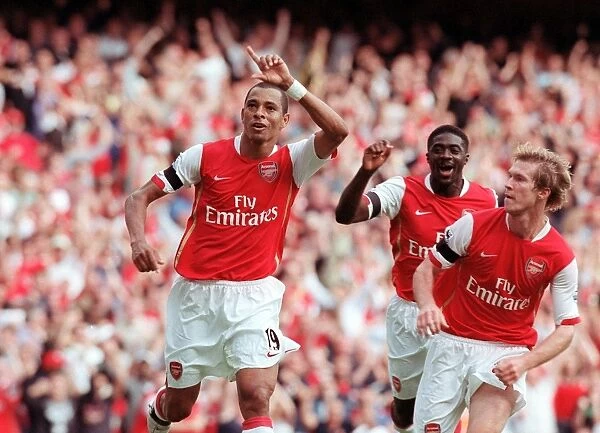 Triumphant Threesome: Gilberto, Hleb, and Toure Celebrate Arsenal's Equalizer