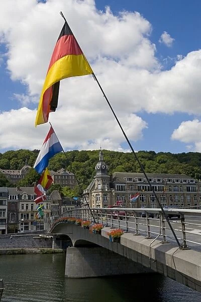 Belgium, Namur, Dinant, flags on bridge across River Meuse