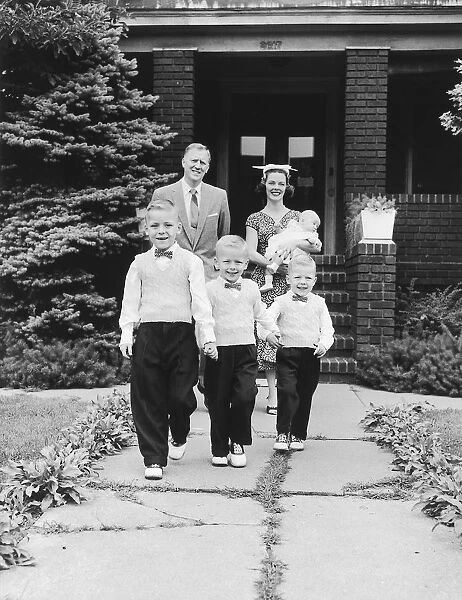Family portrait in front of house, 1957