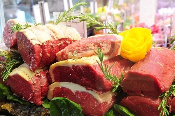 Meat display with rosemary, close-up