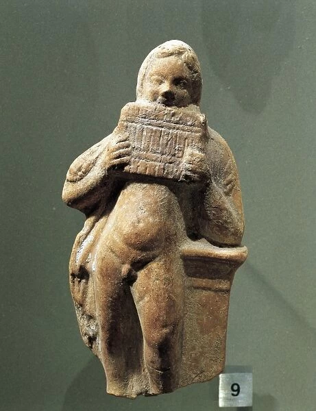 Terracotta statue depicting pan flute player, 333-64 b. c. from Kharayeb, Lebanon