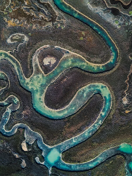 Winding water channel in the marshlands as seen from above, Venetian Lagoon, Italy