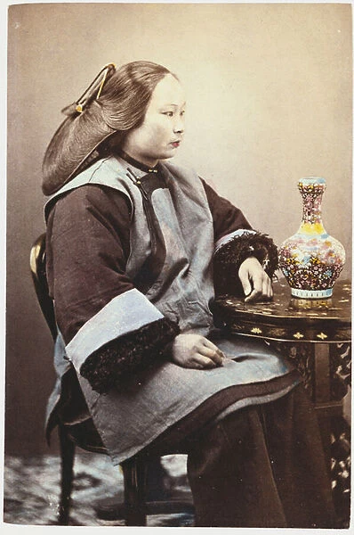 A hand tinted photograph of a young Chinese woman (hand tinted photograph)