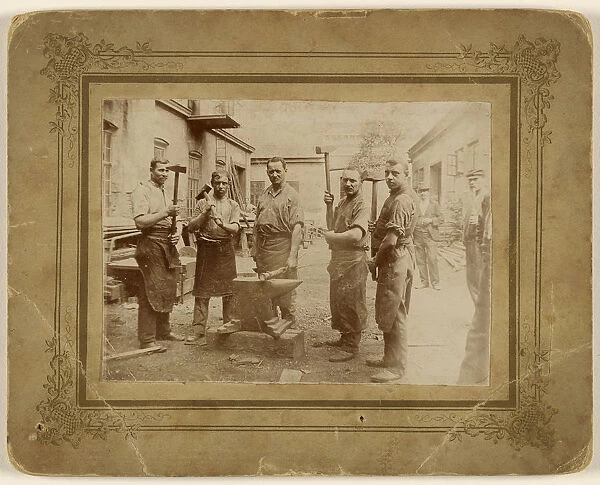 Five blacksmiths anvil holding large hammer 1890