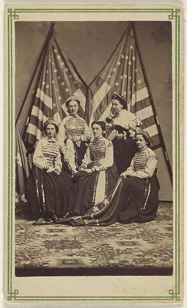 Five women two standing three seated costume