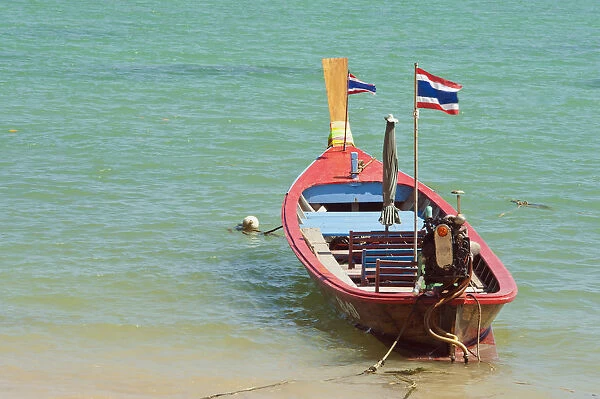 Thailand, Phuket, Rawaii Beach, Close up of longtail boats along the in water