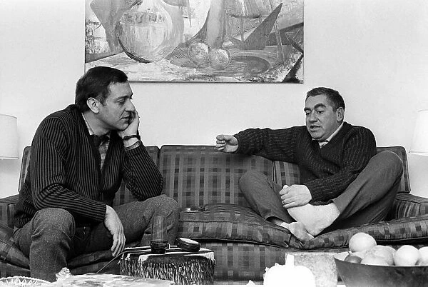 Actor Harry Corbett and Toyn Hancock sit talking in February 1963