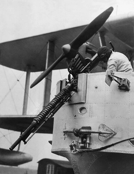 A gunner checks the Coventry Ordnance Works C. O. W 37 mm autocannon in the bow gunners