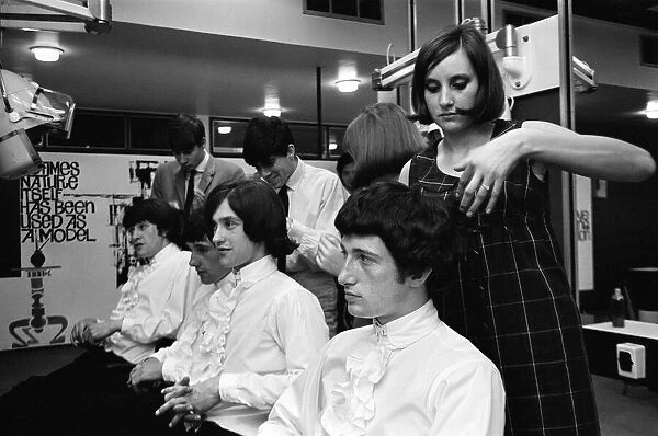 Members of the British pop group The Kinks having their hair styled at a salon