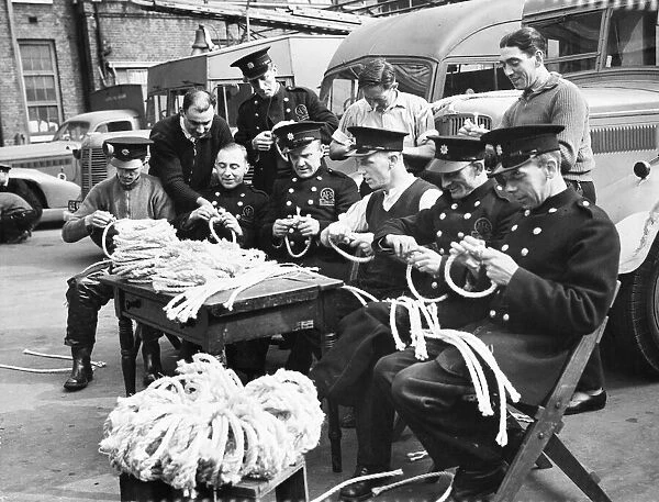 Members of the The Auxiliary Fire Service (AFS), splicing rope. London