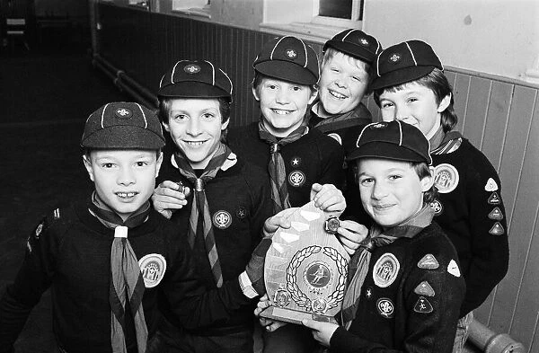 Showing off the shield they won in a five-a-side football competition are these members