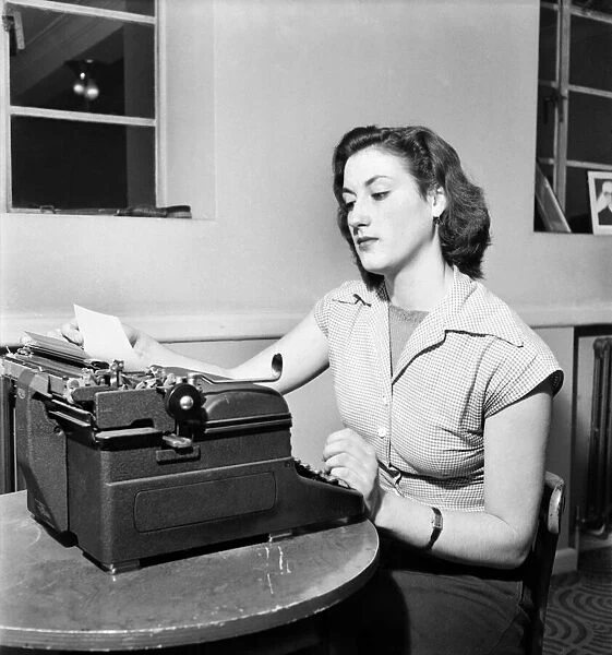 Typist Diana Seal at work. November 1952 C5663