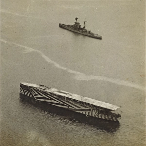 HMS Argus (I49) in habour in 1918, painted in camouflage