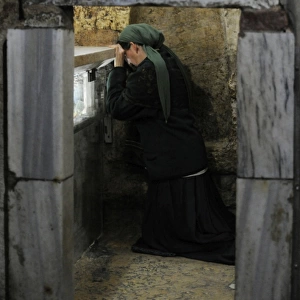 Israel. Jerusalem. Tomb of the Virgin Mary. Woman praying