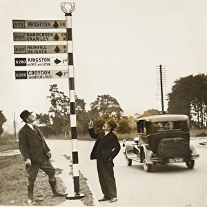 Men and signpost