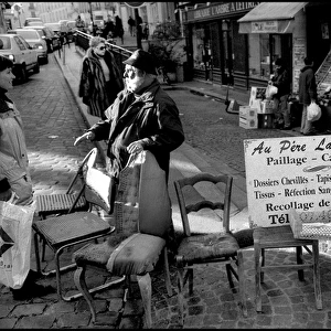 Street scene chairs, flea market, Paris, France