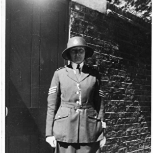 Woman police officer posing in uniform, London, WW2