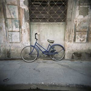 Blue bicycle against a wall, Havana Centro, Havana, Cuba, West Indies, Central America