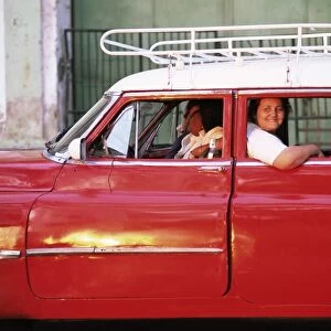 Women waiting in taxi in the early morning, Havana, Cuba, West Indies, Central America