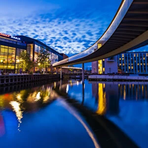 Bridge reflecting in the water canal and Fisketorvet shopping centre in the background by