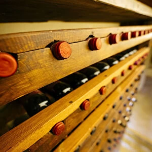 Chianti wine bottles in cellar, Tuscany, Italy