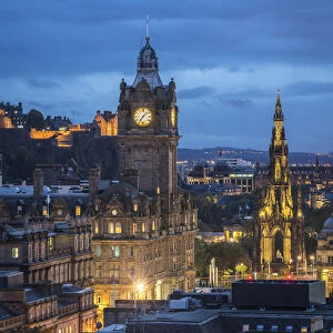 Illuminated Balmoral Hotel clock tower and Scott Monument seen from Observatory House