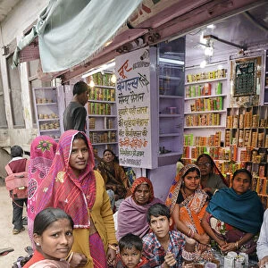 Indian family shopping at store, City of Karauli, Rajasthan, India