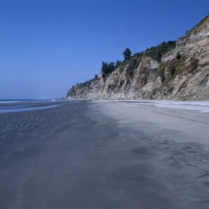BANGLADESH, Chittagong, Coxis Bazar Empty beach and eroded cliff