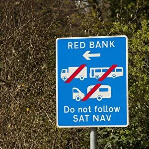 Do Not Follow Sat Nav sign on narrow road, warning drivers not to follow satallite navigation system, England, april