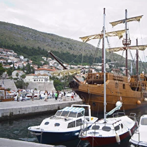 The Karaka 16 century galleon replica boat in the old harbour. Other boats moored