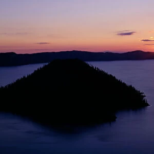 USA, Oregon. Crater Lake National Park, sunrise over Wizard Island and Crater Lake in summer