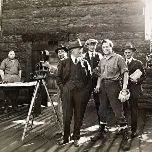 SILENT FILM SET, c1925. Actor Harold Lockwood (holding baseball) and director Fred Balshofer on the set of a silent film, c1925