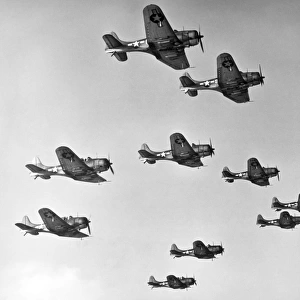 A victory formation of U. S. Douglas Dauntless Dive Bombers. U. S. Douglas Dauntless Dive Bombers were used at the battles of Pearl Harbor and Midway and ceased production in 1944