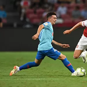 Arsenal's Emile Smith Rowe Clashes with Atletico Madrid's Joaquin Munoz in International Champions Cup 2018