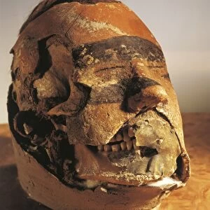 Funerary mask from a tomb found in the Oglahty mountains