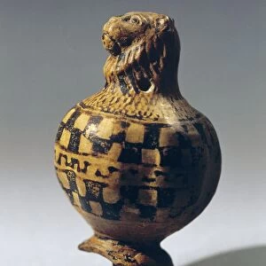 Terracotta spinning top in shape of lions head