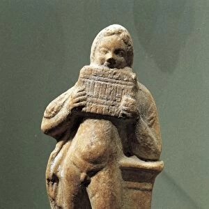 Terracotta statue depicting pan flute player, 333-64 b. c. from Kharayeb, Lebanon