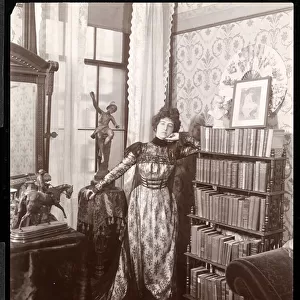 Anita Chartres in the corner of a room, c. 1898 (silver gelatin print)