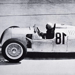 Bernd Rosemeyer at speed in a rear-engined 1936 / 37 Type C