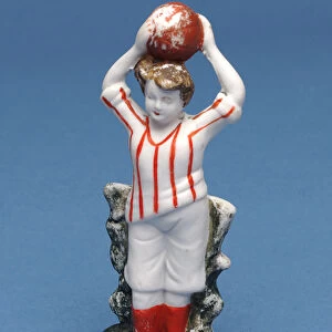 Bisque figure of a footballer throwing the ball in (ceramic)