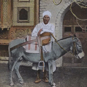 Man with a donkey, Northern Africa (coloured photo)