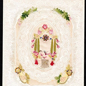 A Victorian paper lace Valentine card of a sleeping cupid surrounded by flowers, c