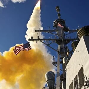 The Aegis-class destroyer USS Hopper launching a standard missile 3 Blk IA in Kauai