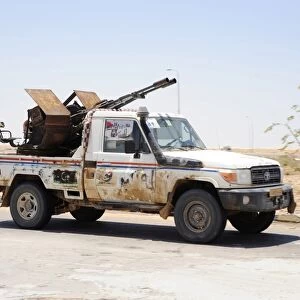 A Free Libyan Army pickup truck with a ZPU-1 anti-aircraft gun, Ajdabiya, Libya