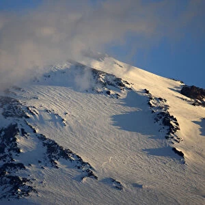 Mount Elbrus the highest mountain in Europe (5, 642m) surrounded by clouds seen