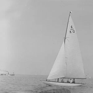 The 6 Metre Flya (K13) sailing close-hauled, 1921. Creator: Kirk & Sons of Cowes